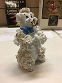 Horn-blowing poodle
